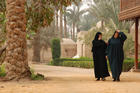 Veiled women walking in the street.
